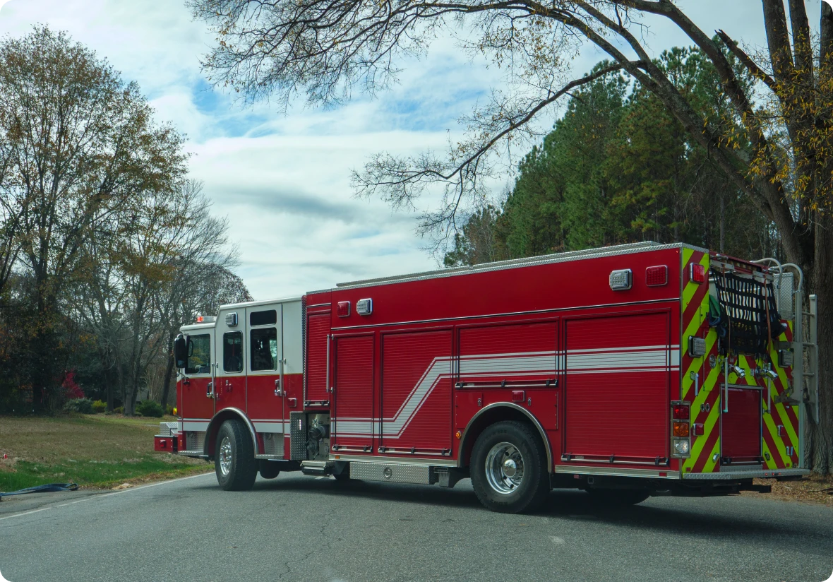 Fire engine parked under cloudy sky